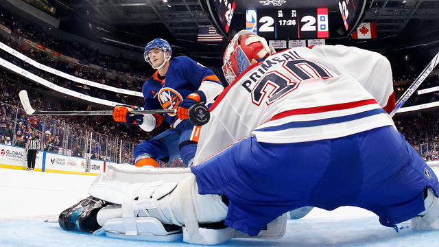 Noah Dobson #8 of the New York Islanders scores the game-winning shootout goal against Cayden Primeau #30 of the Montreal Canadiens at UBS Arena on October 19, 2024 in Elmont, New York. The Islanders defeated the Canadiens 4-3 in the shootout. 