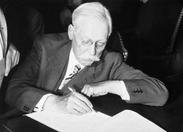 Samuel Insull Signing a Document 