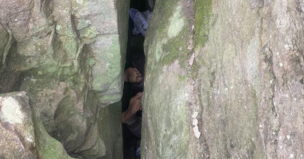 Woman spends 7 hours wedged between boulders after trying to retrieve phone she dropped