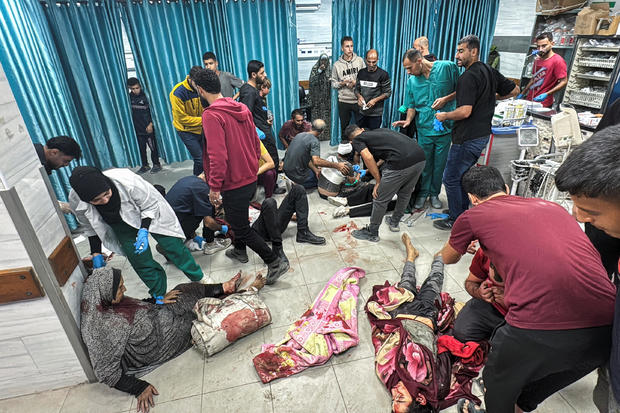 Medics and people assist Palestinian casualties of Israeli fire at Kamal Adwan hospital, amid the ongoing Israel-Hamas conflict, in Jabalia, in the northern Gaza Strip 