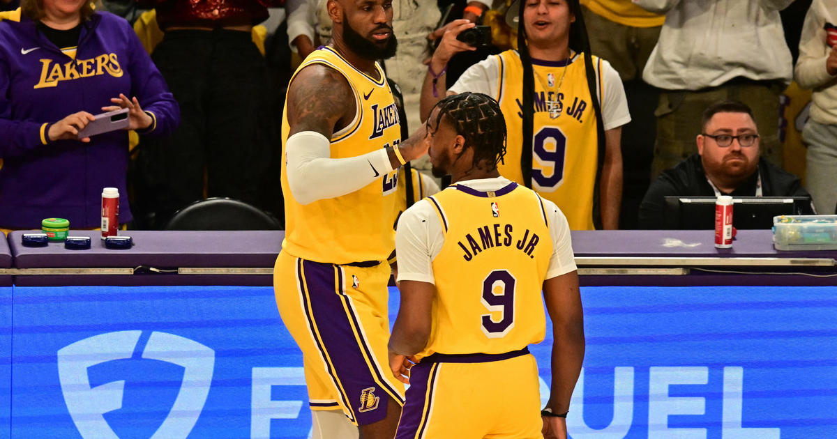 LeBron and Bronny James make history as the NBA s first father son duo to play together CBS Los Angeles