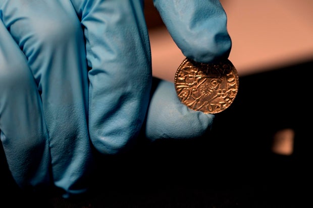 An Edward the Confessor Pyramid coin (1065-6), part of the Chew Valley Hoard of 2,584 coins, buried in the turmoil following the Norman Invasion of Britain in 1066, is seen on display at the British Museum in London
