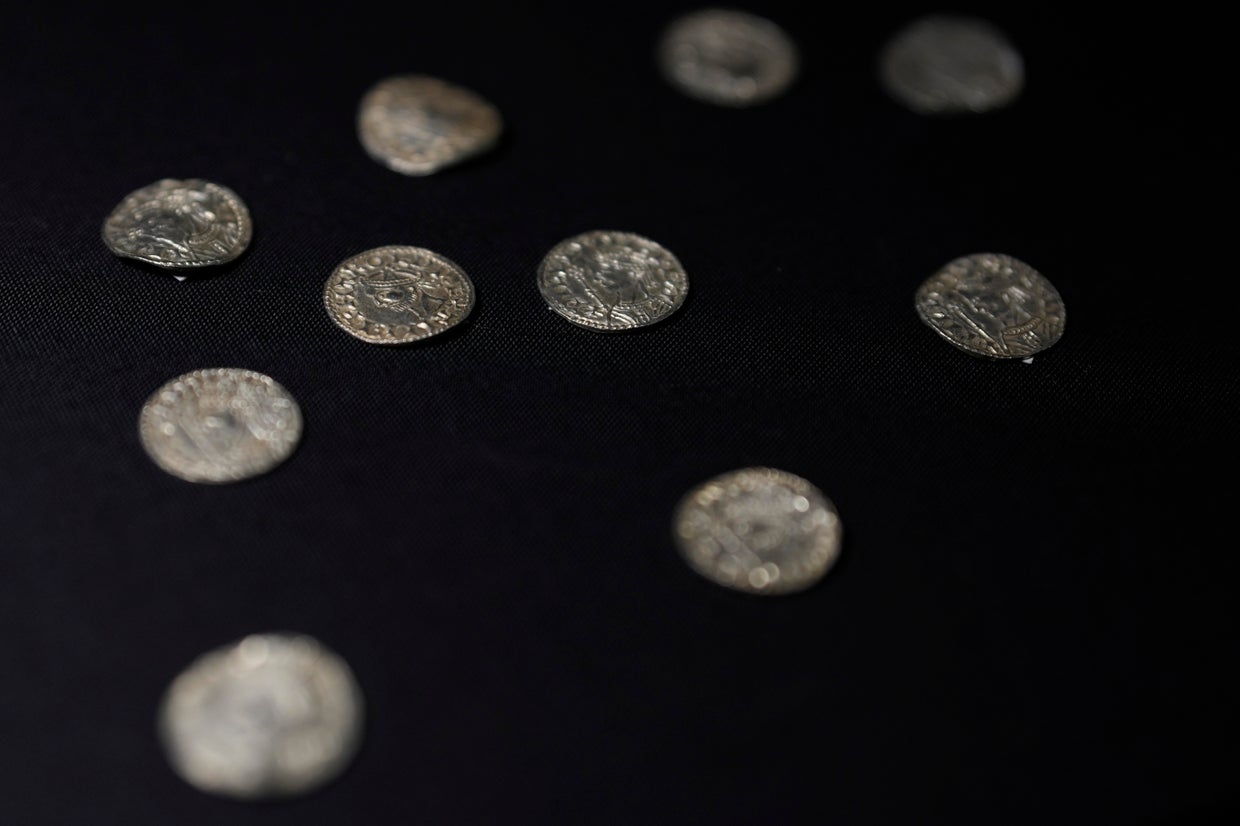 Trove of ancient silver coins unearthed by metal detectorists sells for