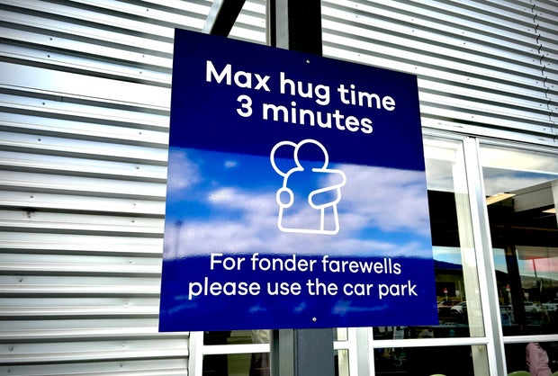 New Zealand airport with 3-minute cap on farewell hugs surprised how much global interest there's been