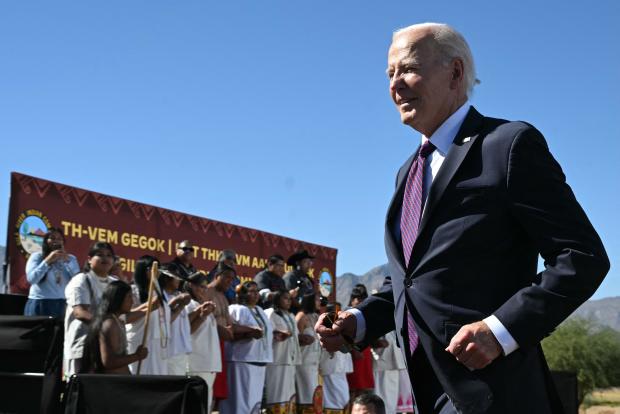 President Biden leaves the stage after speaking at the Gila River Crossing School in the Gila River Indian Community, in Laveen Village, near Phoenix, Arizona, on Oct. 25, 2024. 