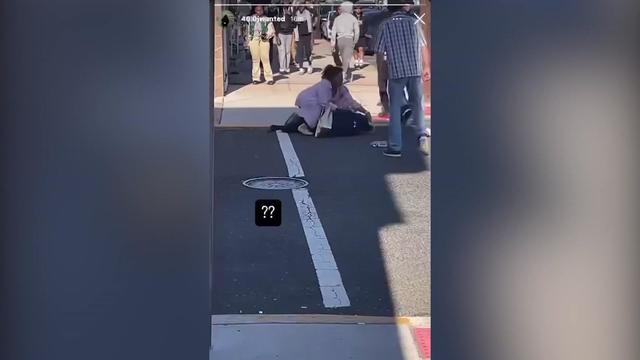 A video from social media shows an educator laying on top of a student in a crosswalk. 