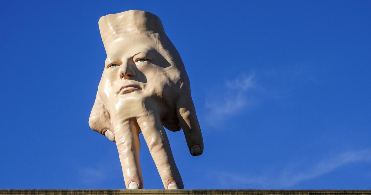 Controversial giant hand's removal from top of building is stirring ...