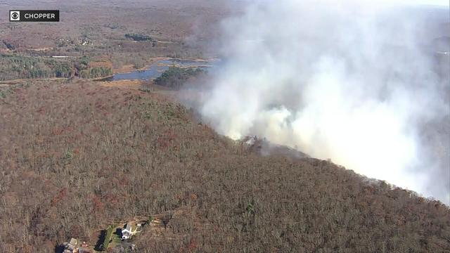 Smoke billows from a wooded area in Morris County, New Jersey. 