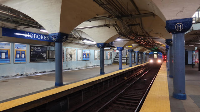 A PATH train arrives from New York City at an empty station on May 21, 2020 in Hoboken, New Jersey. 