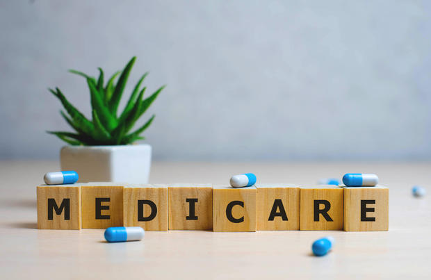 MEDICARE word made with building blocks, medical concept background 