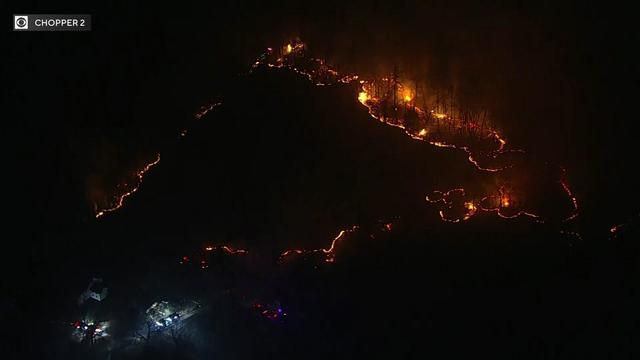 Smoke billows from a wooded area in Morris County, New Jersey. 