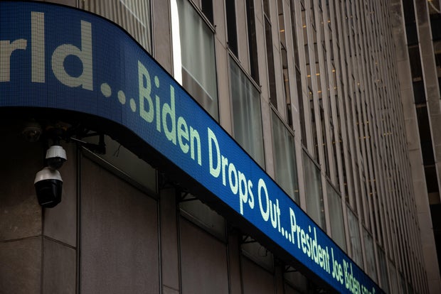 News Reports In Times Square As President Biden Drops Out Of Race