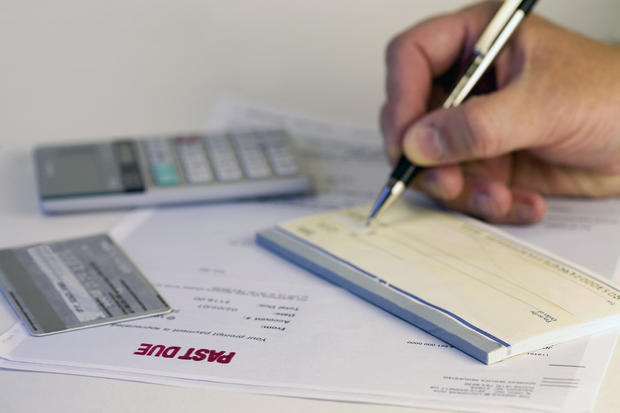 A man writing a check for 