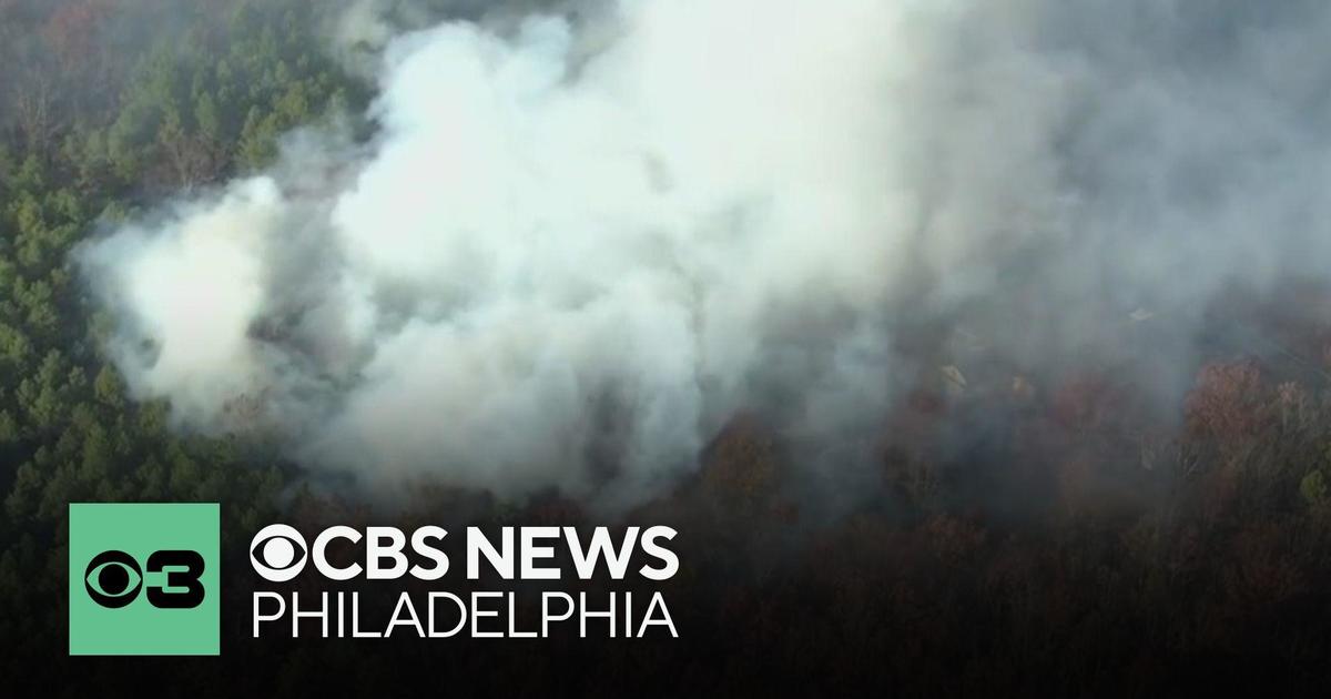 A wildfire in Ocean County, New Jersey forces families to evacuate their homes