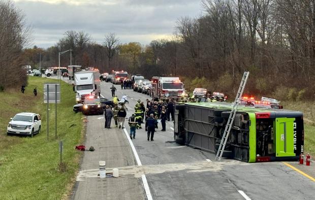 Crews work the scene after a bus overturned on Interstate 490 in Chili, New York, Nov. 7, 2024. 