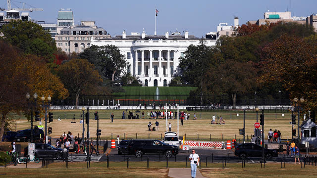 People gather outside the White House, in Washington 