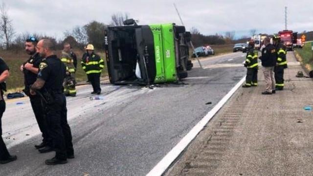 Crews work the scene after a bus carrying passengers rolled over on Interstate 490 west of Rochester, New York, Nov. 7, 2024. 