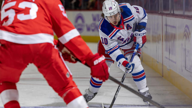 Artemi Panarin #10 of the New York Rangers shoots the puck along the boards during the second period of the game against the Detroit Red Wings at Little Caesars Arena on November 9, 2024 in Detroit, Michigan. 