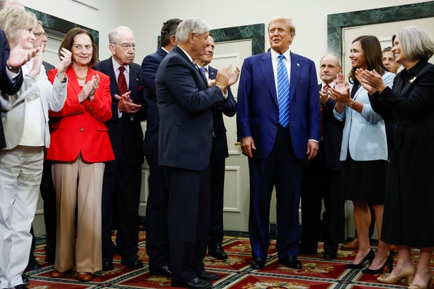 Former President Donald Trump is applauded by Senate Republicans before giving remarks to the press at the National Republican Senatorial Committee building on June 13, 2024 in Washington, DC.