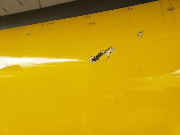 A photo provided by the Dominican Republic's Cibao International Airport shows what looks like a bullet hole in the fuselage of Spirit Airlines Flight 951. 