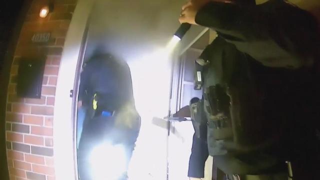 Body camera video shows rescue of elderly couple from Detroit-area house fire 