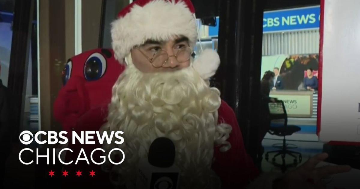 Santa Claus rings the bell for the Salvation Army, shares beautiful list