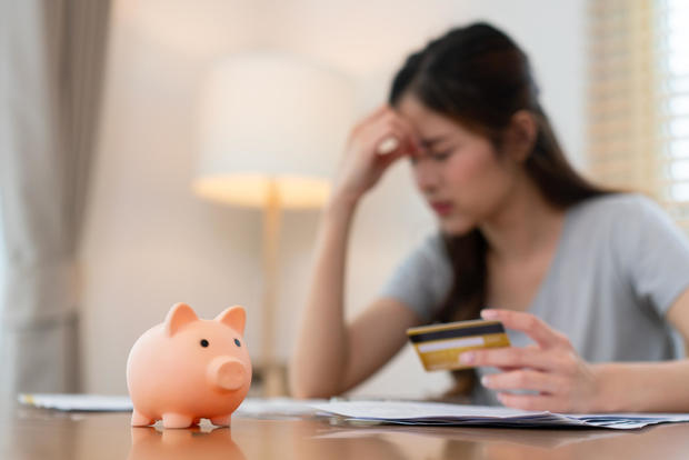 Woman Stressing Over Finances at Home 