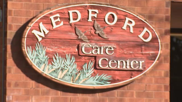 A sign for Medford Care Center 