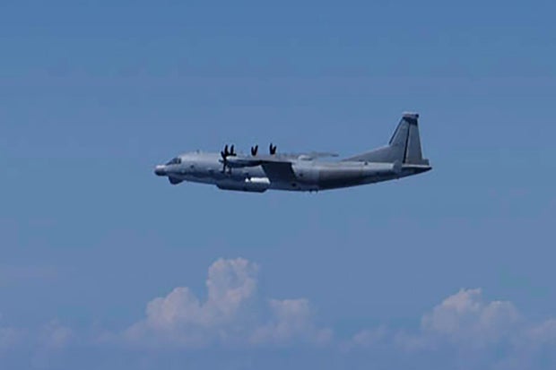 Japan says it will closely watch China's military activity after Beijing admits spy plane violated airspace