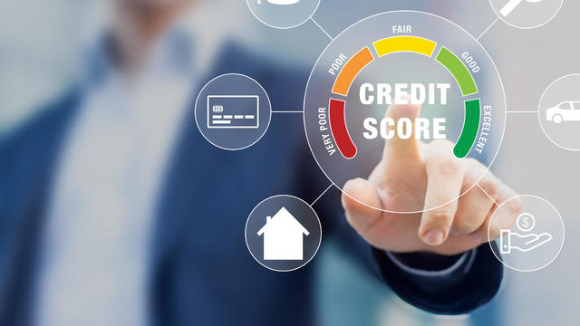 Credit Score rating based on debt reports showing creditworthiness or risk of individuals for student loan, mortgage and payment cards, concept with business person touching scorecard on screen 