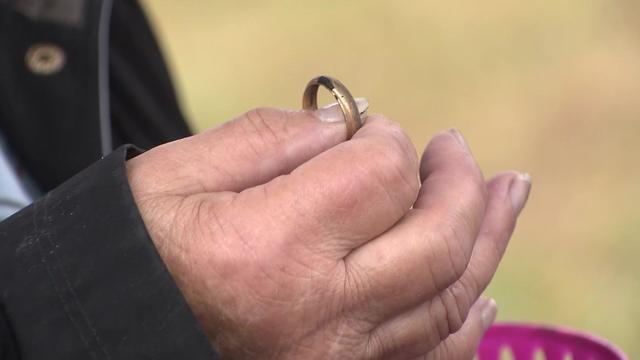 Carole Matyi holds her late husband's wedding ring. 