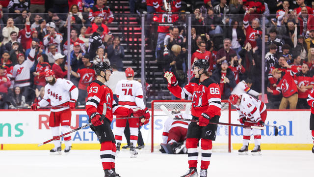 Jesper Bratt #63 of the New Jersey Devils celebrates with Jack Hughes #86 of the New Jersey Devils after scoring a goal during the third period of a NHL game against the Carolina Hurricanes at Prudential Center on November 21, 2024 in Newark, New Jersey. 