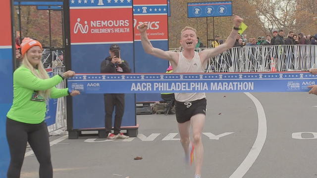 William Loevner breaks the tape at the 2024 Philadelphia Marathon 