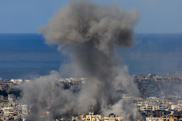 Smoke billows over Beirut's southern suburbs after Israeli strike, as seen from Baabda 