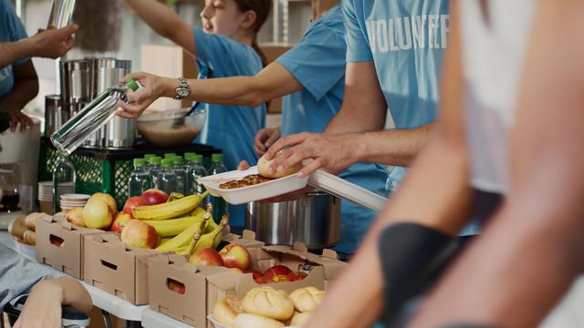 Poor Wheelchair User Receiving Free Food 