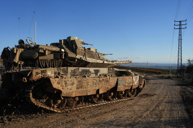 An Israeli tank maneuvers, amid cross-border hostilities between Hezbollah and Israel, by Israel's border with Lebanon 