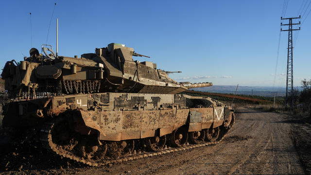 An Israeli tank maneuvers, amid cross-border hostilities between Hezbollah and Israel, by Israel's border with Lebanon 