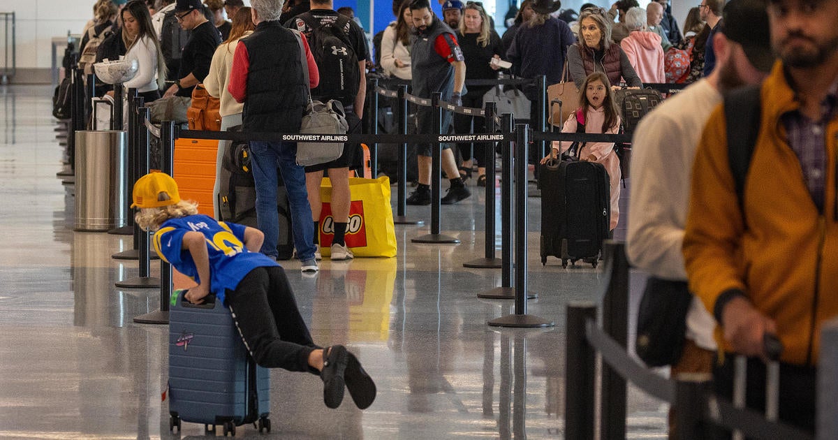 Another busy travel day is expected at LAX as heavy fog hangs over the airport