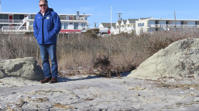 Mayor Patrick Rosenello stands next to a destroyed section of sand dune in North Wildwood, New Jersey 