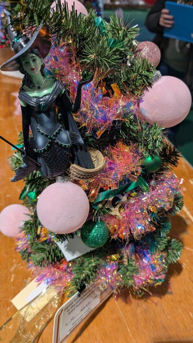 A "Wicked" themed holiday tree designed by  Tim Williams, Steve Sosna, Sina Gebre-Ab and Angela Foster for the 2024 Festival of Trees. 