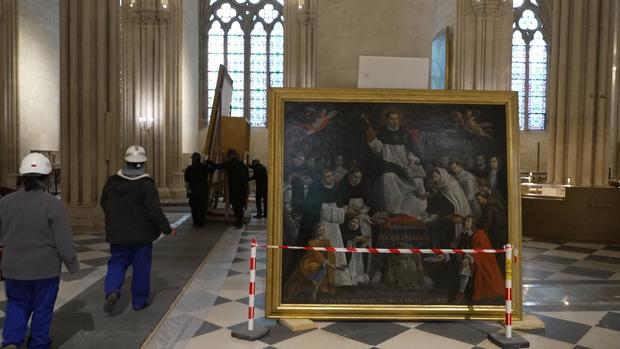 Workers inside Notre Dame 