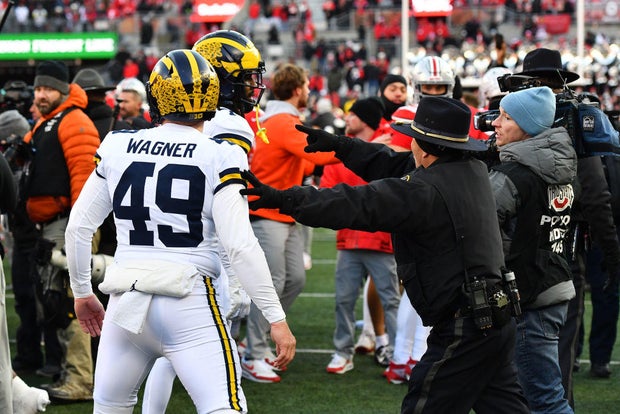 Police use pepper spray during a brawl after Michigan broke ground at Ohio State