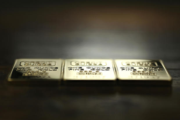 three 1 ounce gold ingots 