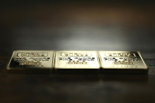 three 1 ounce gold ingots