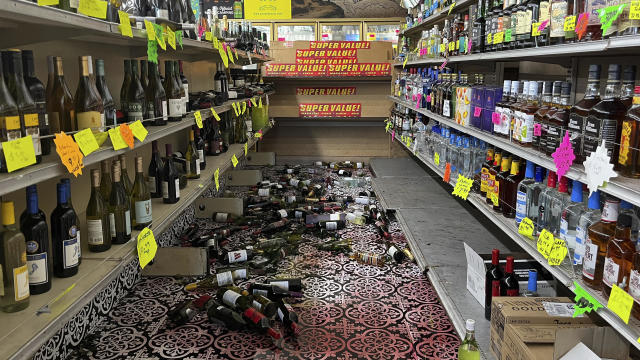 Broken bottles are scattered on the floor inside E&J Liquors after a 7.0 magnitude earthquake, Dec. 5, 2024, in Rio Dell, California. 