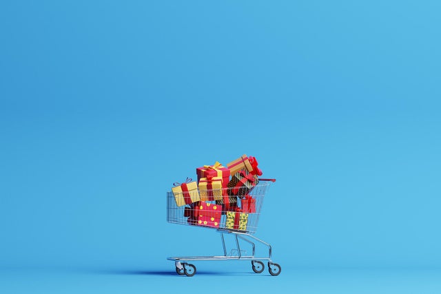 Shopping cart filled with christmas gifts 