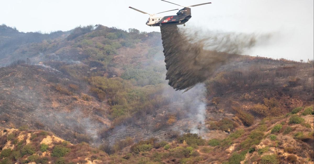 Firefighters battle Malibu wildfire as thousands evacuate