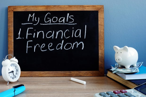 My goals and financial freedom written on a blackboard. 