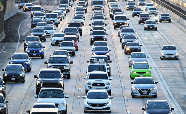 Cars make their way in traffic on a Los Angeles freeway on Jan. 25, 2024.
