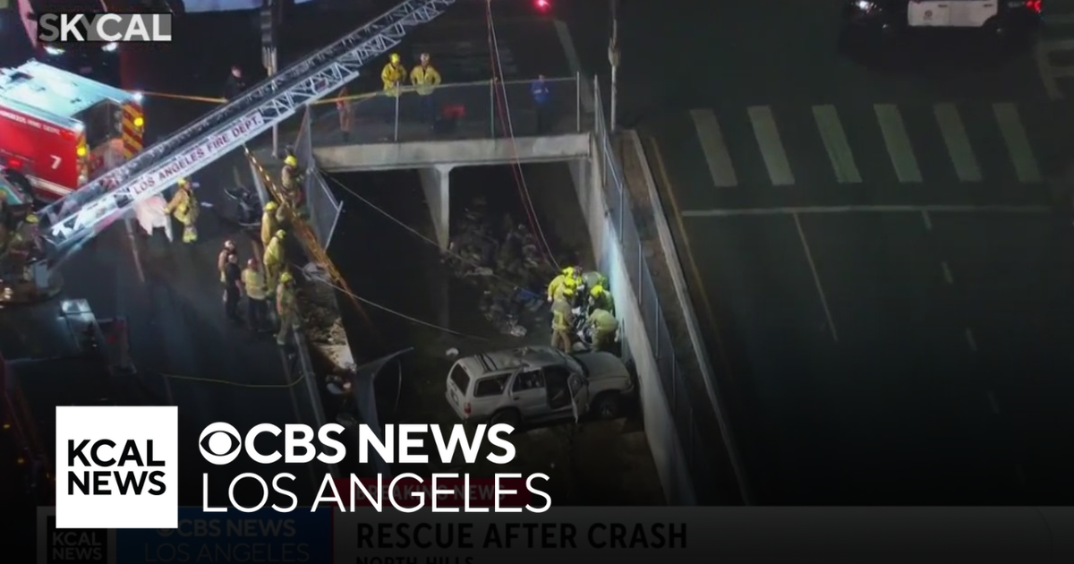 Driver rescued after crash causes car to veer into wash in North Hills ...